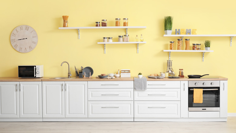 A kitchen with cheery yellow walls.