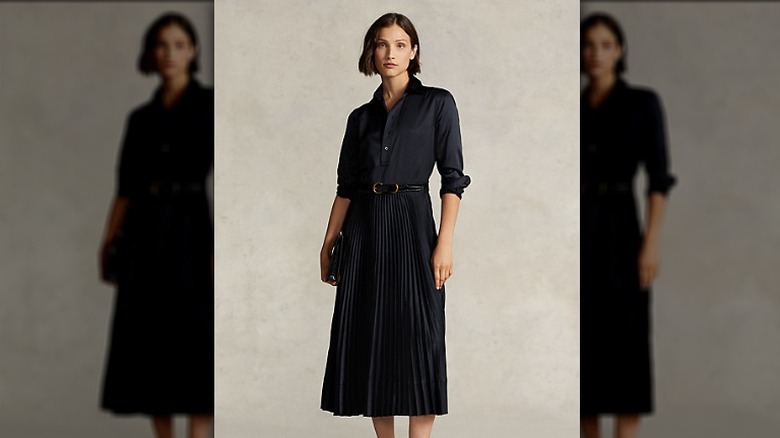 Model wears navy pleated Ralph Lauren dress