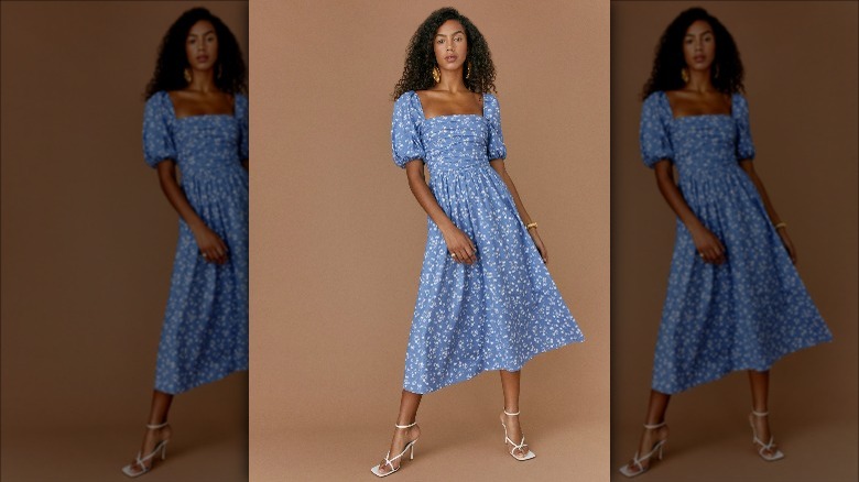 Reformation model wears blue dress with puffy sleeves