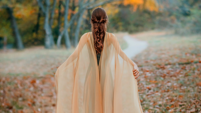 Woman wearing cape gown