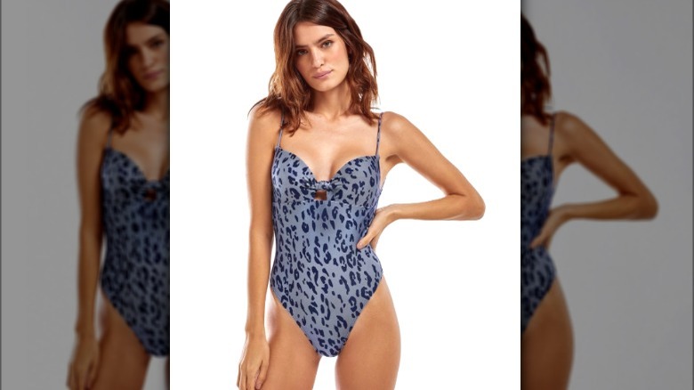 Model wearing a blue animal print swimsuit