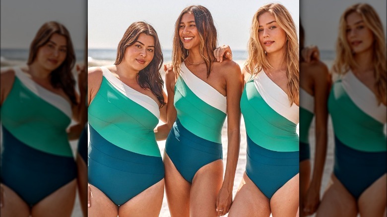 Models wearing green one-shoulder swimsuits