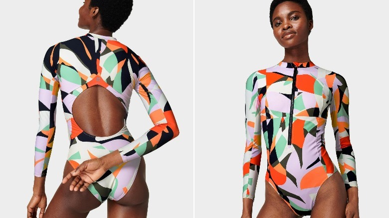 Black model wearing geometric print long sleeve swimsuit