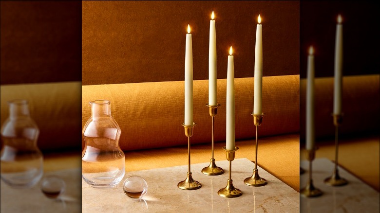 electronic taper candles in brass candle holders