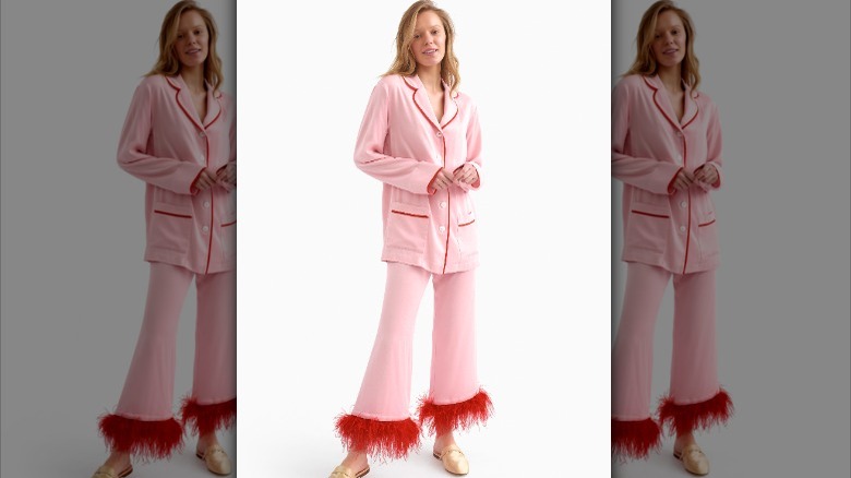 Woman wearing pink feathery pajamas