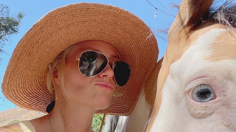 Beth Behrs with a horse