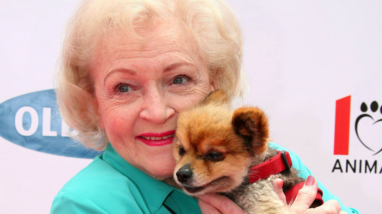 Betty White holding a puppy