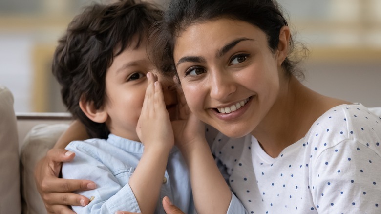 Child talking to babysitter