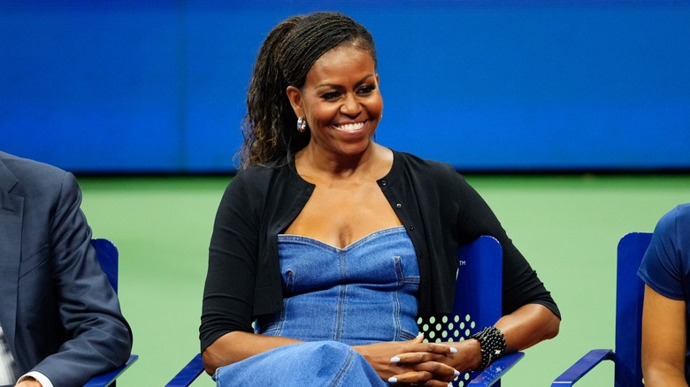 Michelle Obama sitting smiling