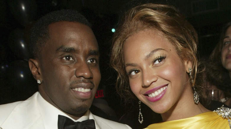 Diddy and Beyonce smiling.