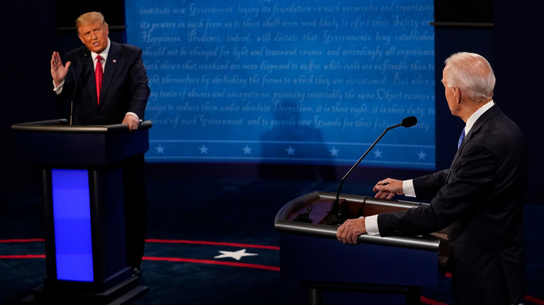 Donald Trump speaks to Joe Biden during a debate