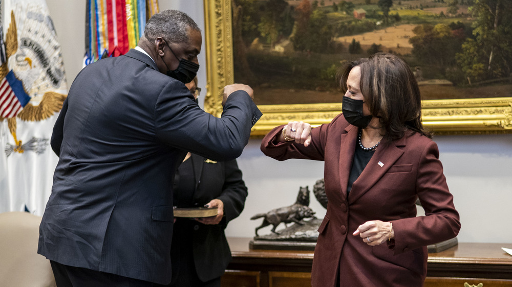 Kamala Harris elbow bumping the Secretary of Defense