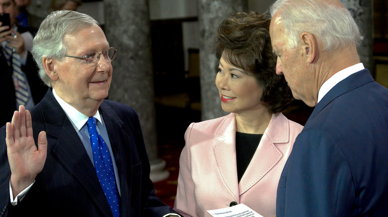 Senate Minority Leader Mitch McConnell, wife Elaine Chao, and then-Vice President Joe Biden in 2015.