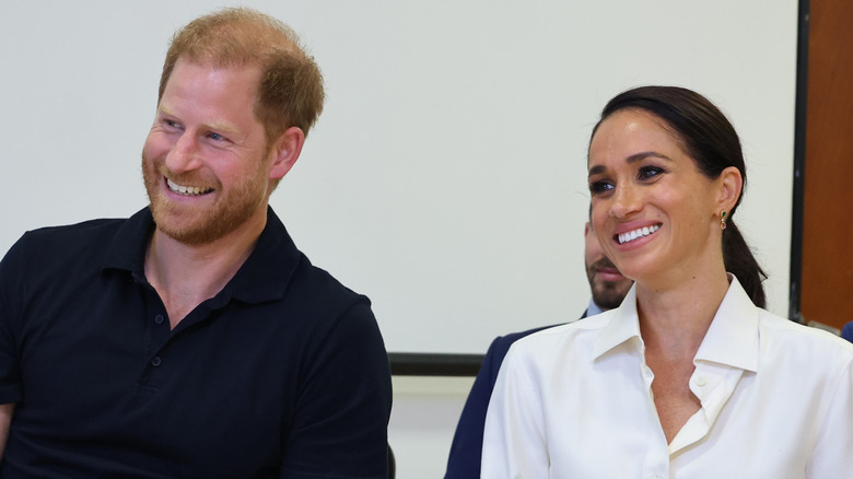 Meghan Markle and Prince Harry standing together