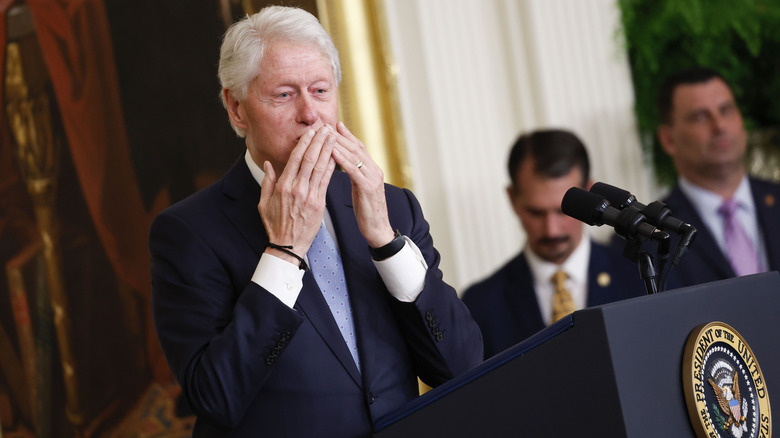 Bill Clinton blows a kiss