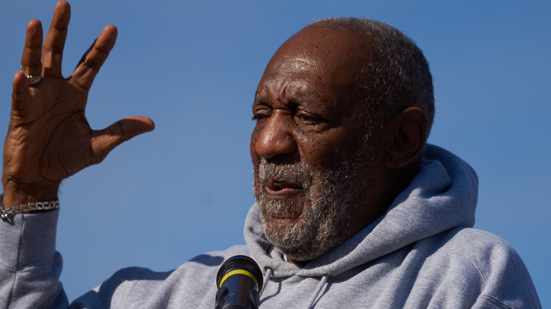 Bill Cosby speaking into mic