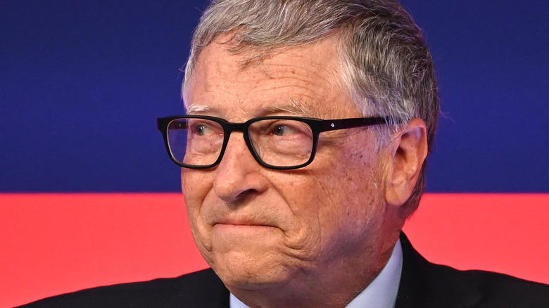 Bill Gates looking to the side with pursed lips