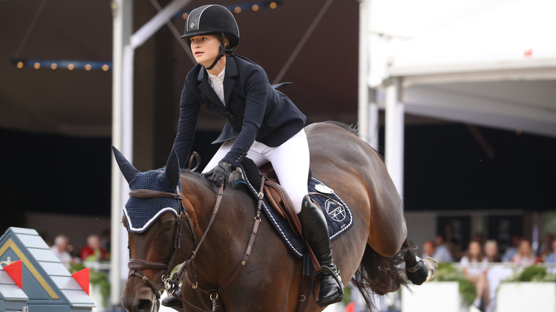 Jennifer Gates riding a horse