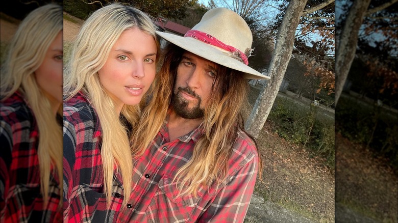 Billy Ray Cyrus and Firerose posing