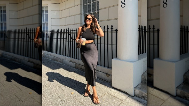 woman posing with drink