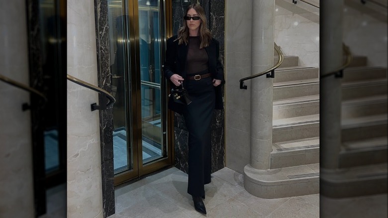 woman posing in black outfit