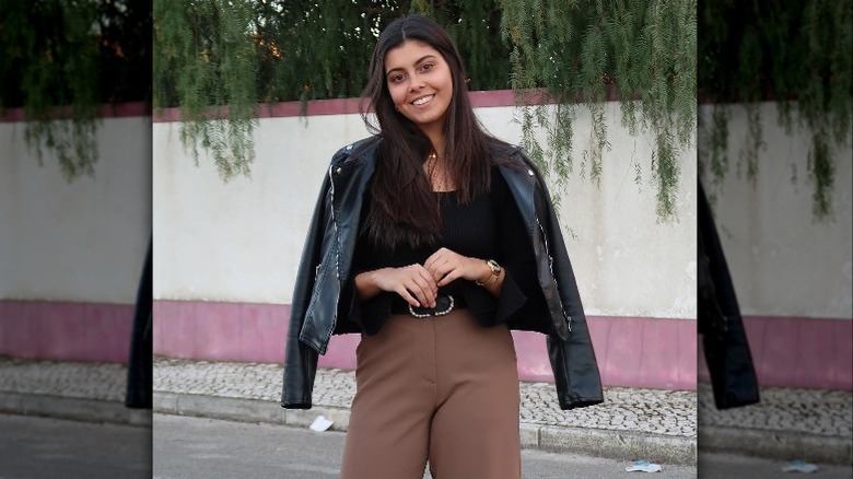 woman with leather jacket smiling