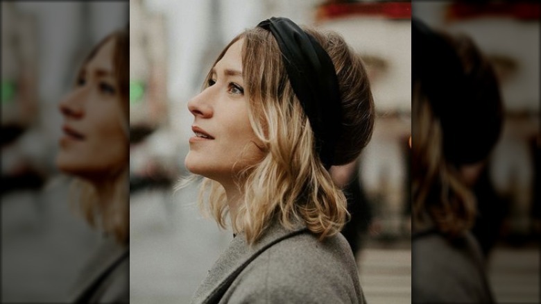 Closeup of woman wearing black headband