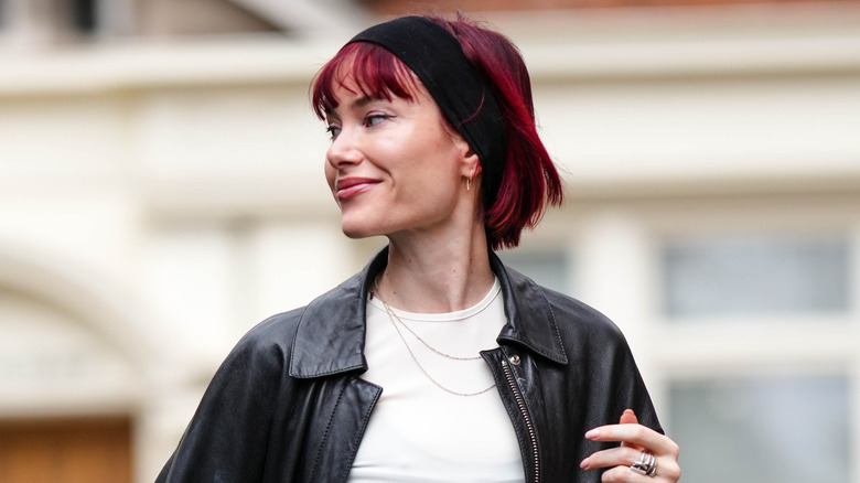 woman with bob wearing black headband