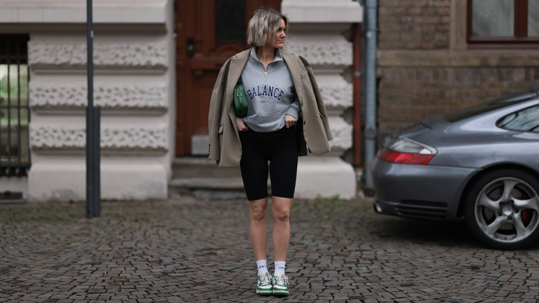 Woman in a blazer and biker shorts