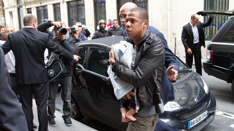 Jay-Z carrying baby Blue Ivy Carter