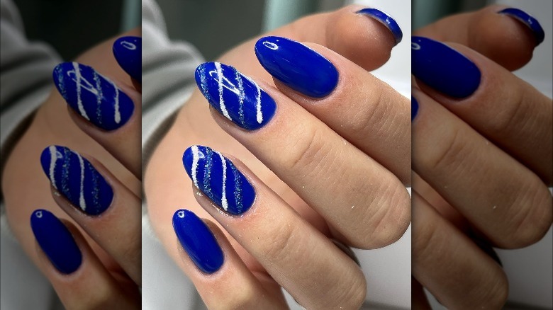 bright blue nails two with stripes