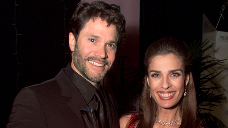 Kristian Alfonso and Peter Reckell smiling at an event. 