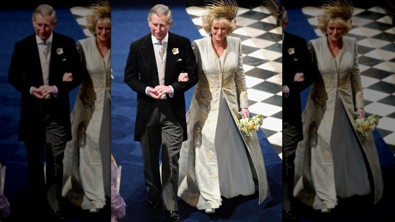 King Charles and Queen Camilla walking down aisle