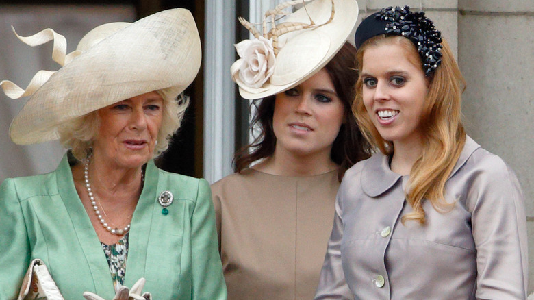 Camilla interacts with smiling Beatrice 