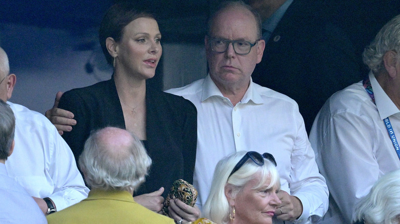 Albert and Charlene in the stands at rugby game