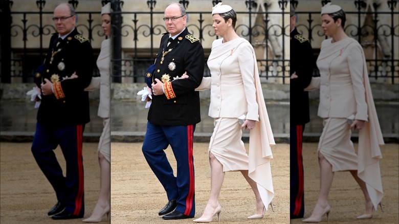 Albert and Charlene in formal attire, walking