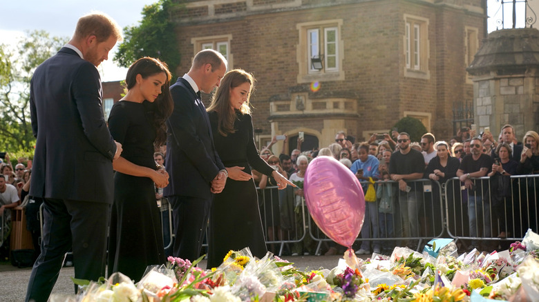 Prince William, Kate Middleton, Prince Harry, and Meghan Markle outside Windsor