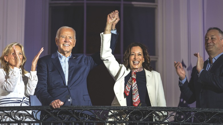 Joe Biden and Kamala Harris holding hands White House balcony