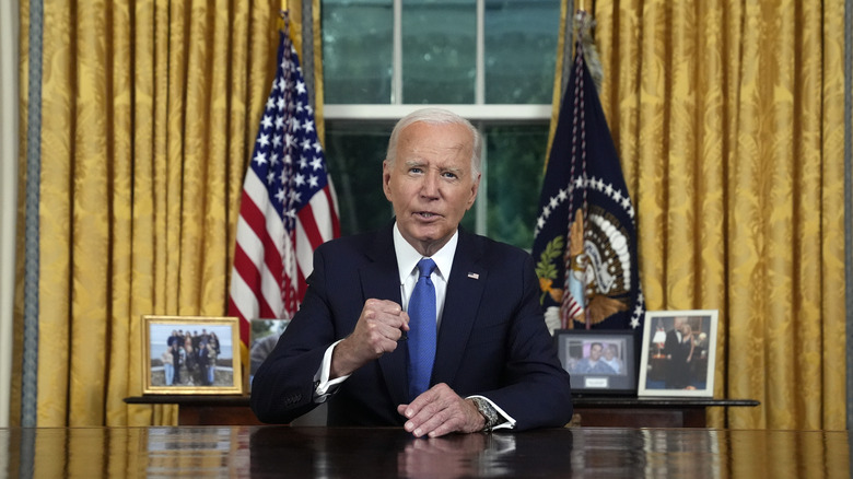 President Biden Oval Office address with fist