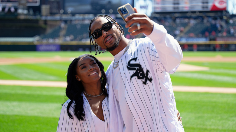 Jonathan Owens taking a selfie with Simone Biles