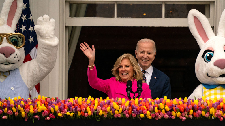 Jill Biden waving in front of Joe Biden