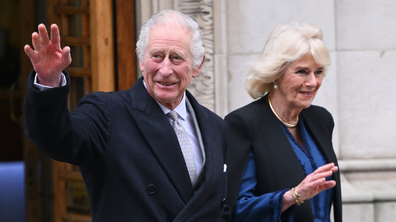 Charles and Camilla waving