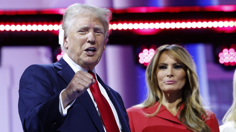 Donald Trump standing with Melania Trump