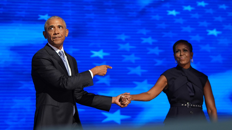 Barack Obama and Michelle Obama holding hands