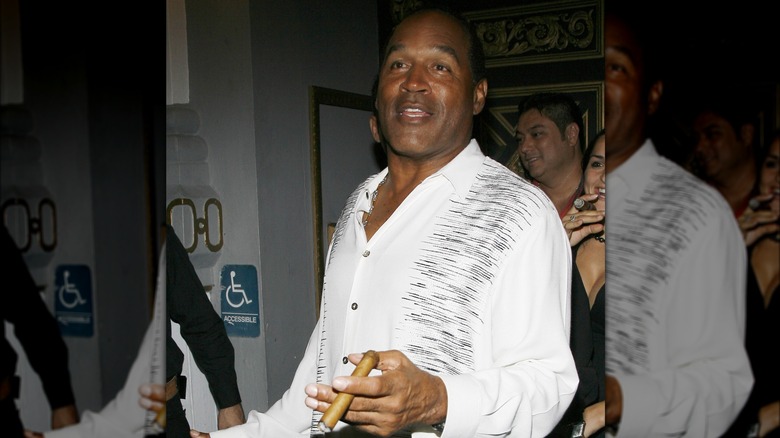 O.J. Simpson holding cigar