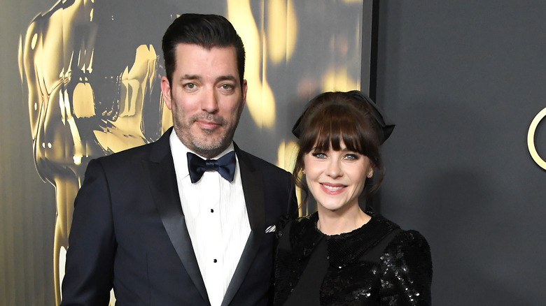 Jonathan Scott Zooey Deschanel smiling on the red carpet of the 15th Governors Awards