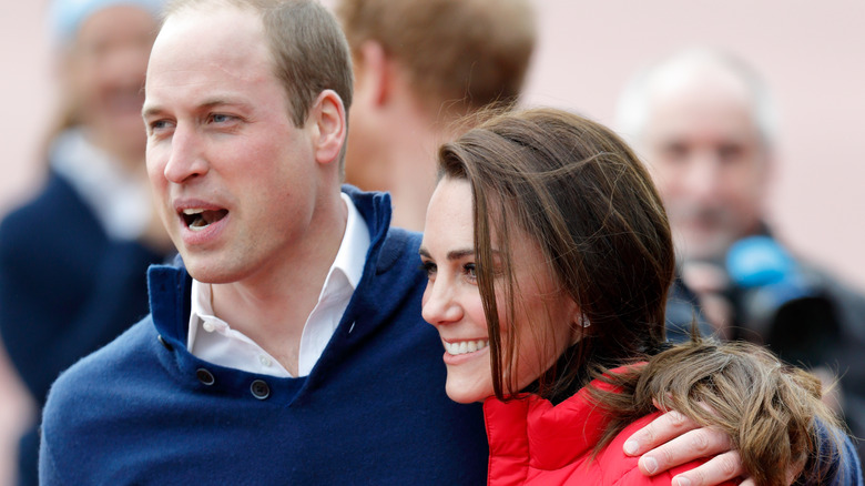 William putting his arm around Kate