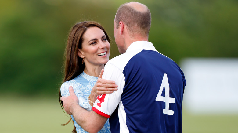 Kate grabbing Prince William's arm