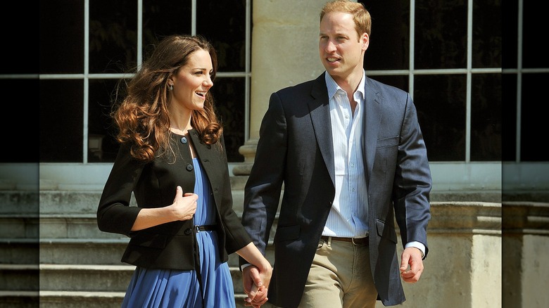William and Kate holding hands walking