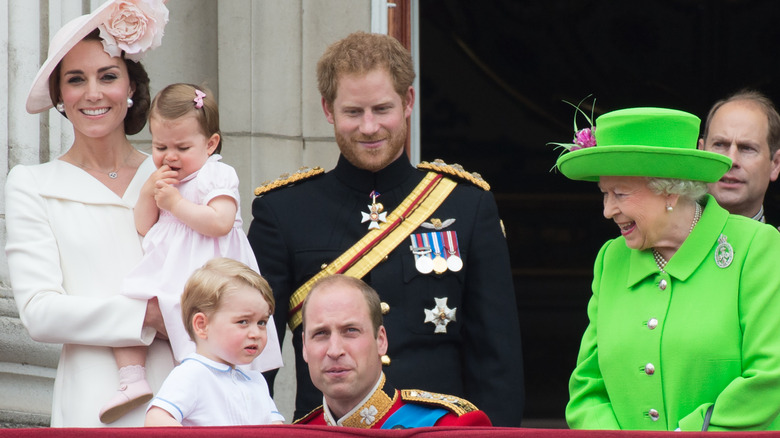 Prince Harry looking at Prince George endearingly